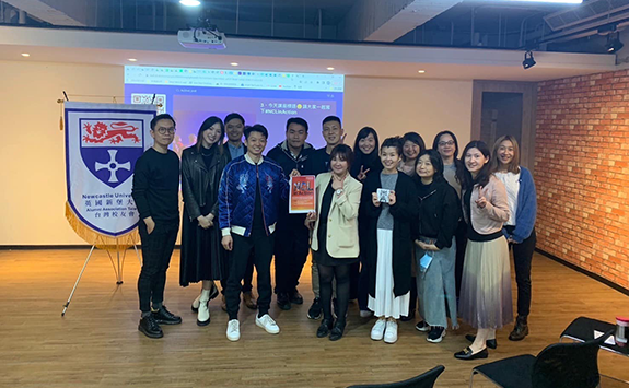 14 members of the Newcastle University Taiwan Alumni Association smiling at the camera at a recent event. 